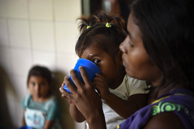 Tudi stopnja podhranjenosti otrok je izjemno visoka. FOTO: Yuri Cortez/AFP