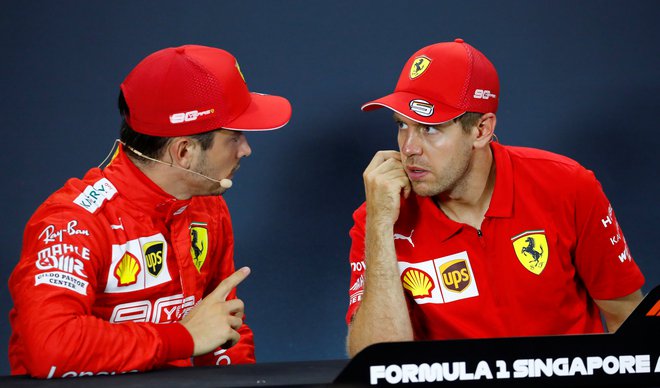 Ferrarijeva sotekmovalca<strong> Charles Leclerc in Sebastian Vettel </strong>še ugibata o začetku nove sezone. FOTO: Reuters
