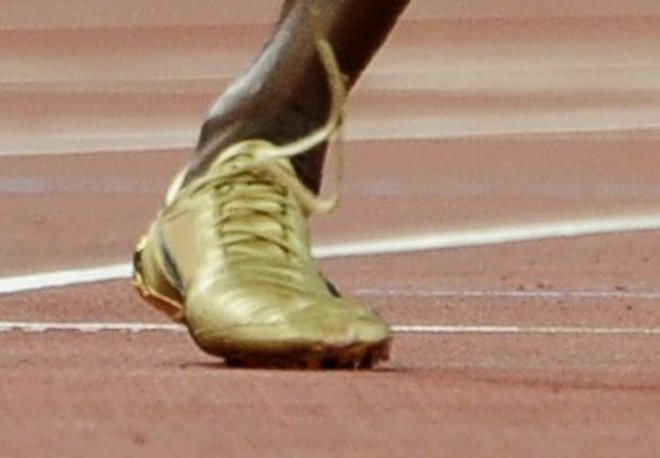 3,53 sekunde je bil Bolt v stiku s tlemi, ko je postavil svetovni rekord na 100 metrov. FOTO: Reuters