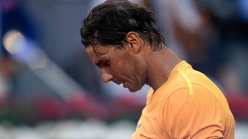 Fotografija: Rafael Nadal je igrišče zapuščal sklonjene glave. Foto Oscar del Pozo/AFP