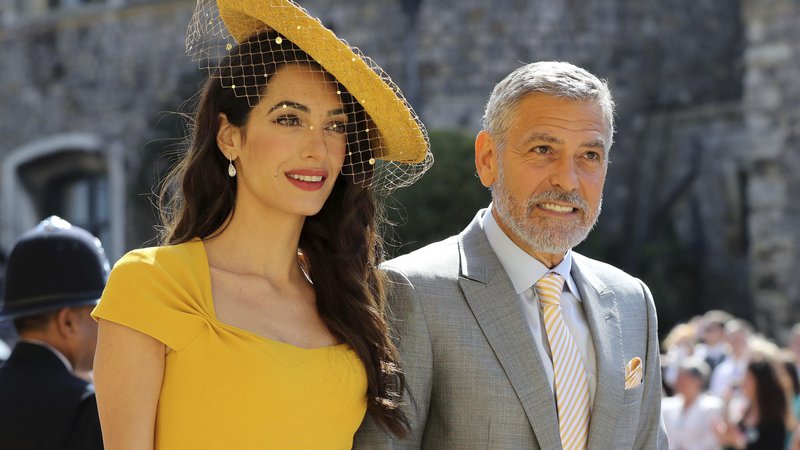 Fotografija: Amal in George Clooney. FOTO: Gareth Fuller/AP