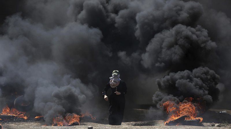 Fotografija: Svet ZN za človekove pravice se je na zahtevo več držav v petek sestal na izrednem zasedanju zaradi nedavnega nasilja na območju Gaze. FOTO: Khalil Hamra/AP