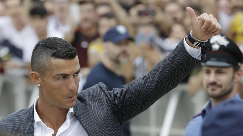Fotografija: Cristiano Ronaldo se je pred tedni preselil v Italijo. FOTO: Luca Bruno/AP