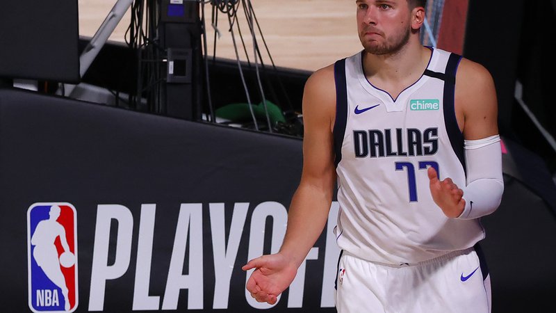 Fotografija: Luka Dončić bo v novi sezoni lige NBA delal z rahlo spremenjenim strokovnim štabom Dallasa. FOTO: Kevin C. Cox/AFP
