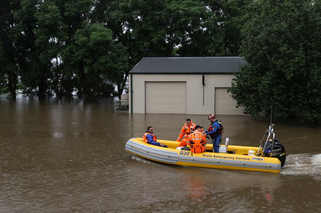 Avstralija se sooča s katastrofalnimi poplavami. FOTO: Loren Elliott/Reuters
