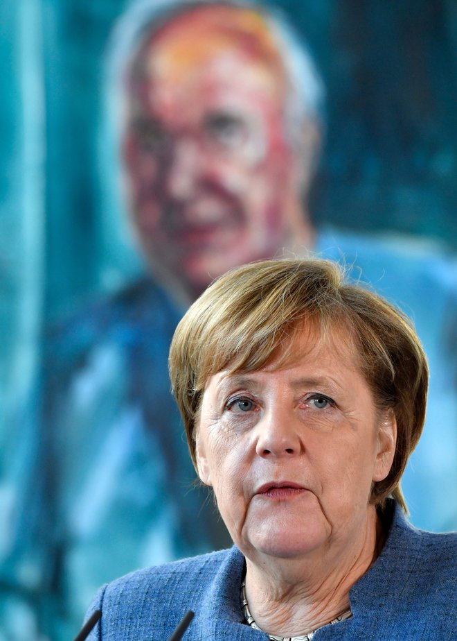 Angele Merkel se je na začetku njene politične poti prijel vzdevek Kohlova deklica. FOTO: John MacDougall/AFP