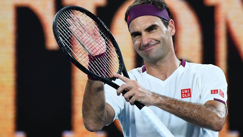 Fotografija: Roger Federer bo teniški lopar obesil na klin. FOTO: William West/AFP
