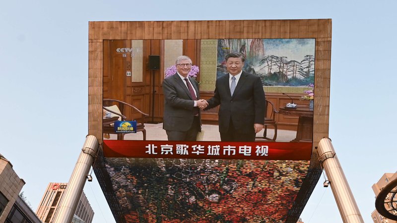 Fotografija: Gates, je dejal Xi, je »prvi ameriški prijatelj, s katerim sem se letos srečal«. FOTO: Greg Baker/AFP