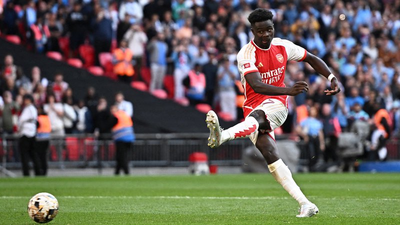Fotografija: Bukayo Saka je zadel na zadnjih treh tekmah proti Unitedu, tudi v nedeljo bo prvi adut Arsenala. Foto Dylan Martinez/Reuters