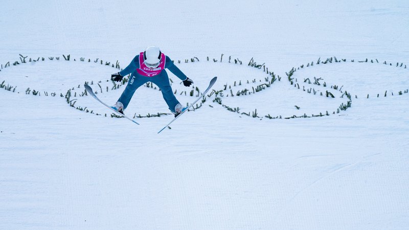 Fotografija: Mark Hafnar je v Romuniji tekmoval v trdnem zimskem olimpijskem duhu. FOTO: Bob Martin/Reuters