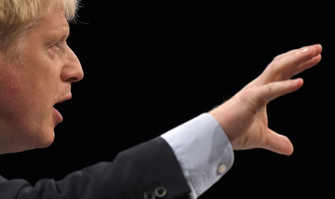Boris Johnson med svojim današnjim nastopom na kongresu konservativne stranke v Manchestru. FOTO: AFP
