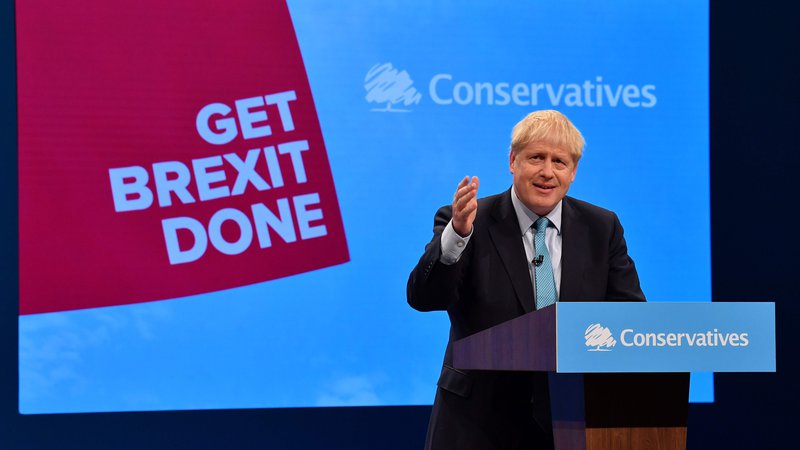 Fotografija: Britanski premier Boris Johnson med nastopom na kongresu konservativne stranke v Manchestru. Foto Afp