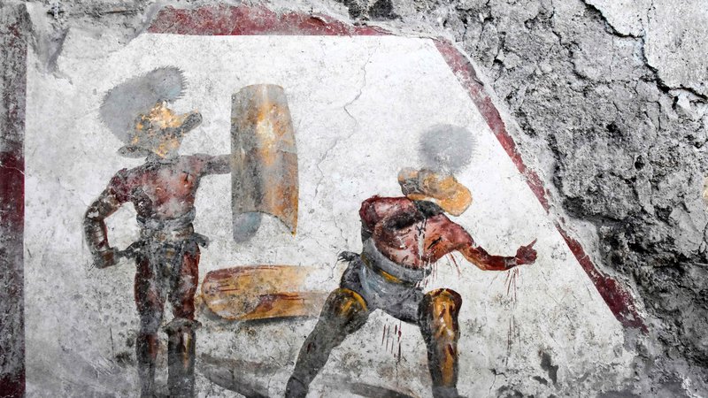 Fotografija: Fresko so odkrili v starorimskem lokalu, ki so ga verjetno tudi obiskovali gladiatorji. FOTO: AFP
