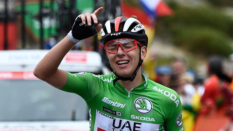 Fotografija: Nepozabni trenutek iz letošnje sezone: zmaga Tadeja Pogačarja v 20. etapi Vuelte, s katero si je zagotovil končno 3. mesto. FOTO: AFP