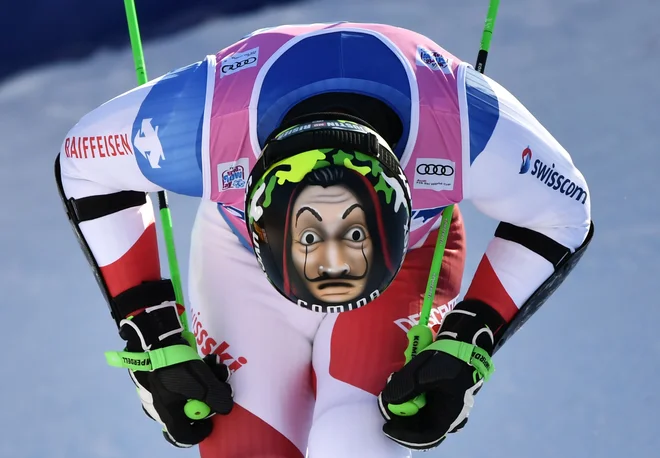 Portret Švicarja Justina Murisierja med prečkanjem ciljne črte na veleslalomu v Adelbodenu. FOTO: Fabrice Coffrini/AFP