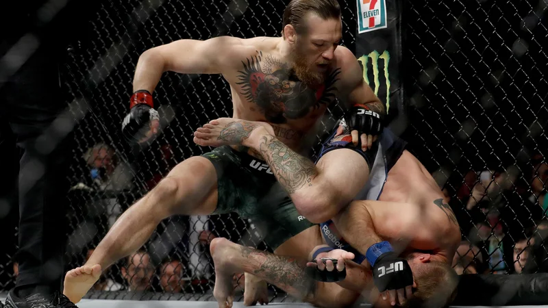 Fotografija: Conor McGregor je po hitrem postopku opravil z Donaldom Cerronejem. FOTO: AFP