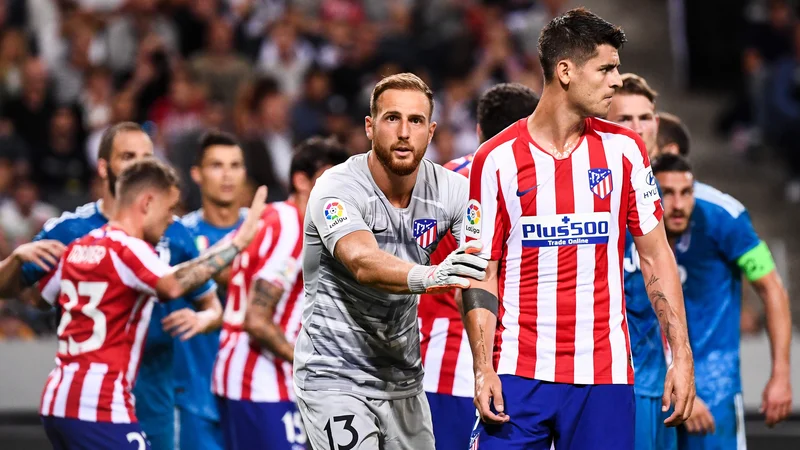 Fotografija: Jan Oblak bo čuval vrata Atletica, Alvaro Morata bo napadal vrata svojega nekdanjega kluba Reala. FOTO: AFP