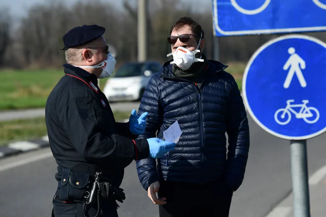 Novi koronavirus je v Italiji doslej zahteval pet življenj. FOTO:&nbsp; Miguel Medina/AFP