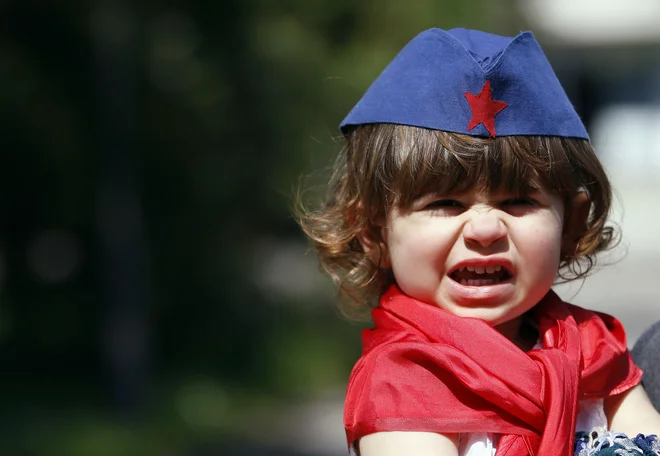 Nekaj trenutkov zatem je nastala smrtna tišina. Čez celotno platno se je pojavila fotografija Josipa Broza Tita. Noben komentar ni bil potreben. Vsi smo vedeli, kaj to pomeni. FOTO: Reuters