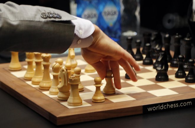 Carlsen in Caruana se merita za naslov prvaka. FOTO: AP