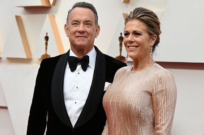 Prva med zvezdniki; Tom Hanks in žena Rita Wilson sta zbolela v Avstraliji. Foto AFP