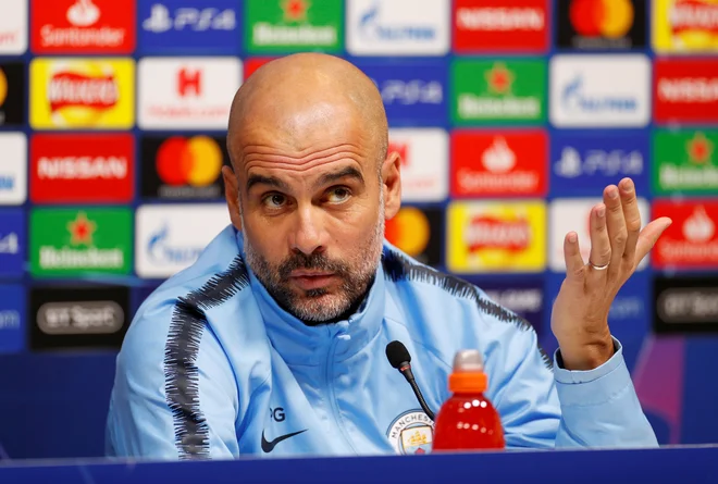 Pep Guardiola je izžareval energijo med zadnjim druženjem z novinarji. FOTO: Reuters