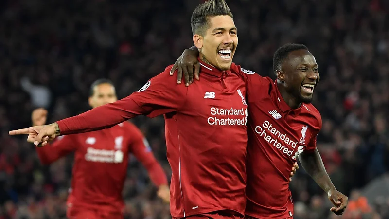 Fotografija: V Liverpooli sta potopila Porto nekdanja nogometaša iz bundeslige: napadalec Roberto Firmino in Naby Keita, nekdanji soigralec Kevina Kampla. FOTO: AFP