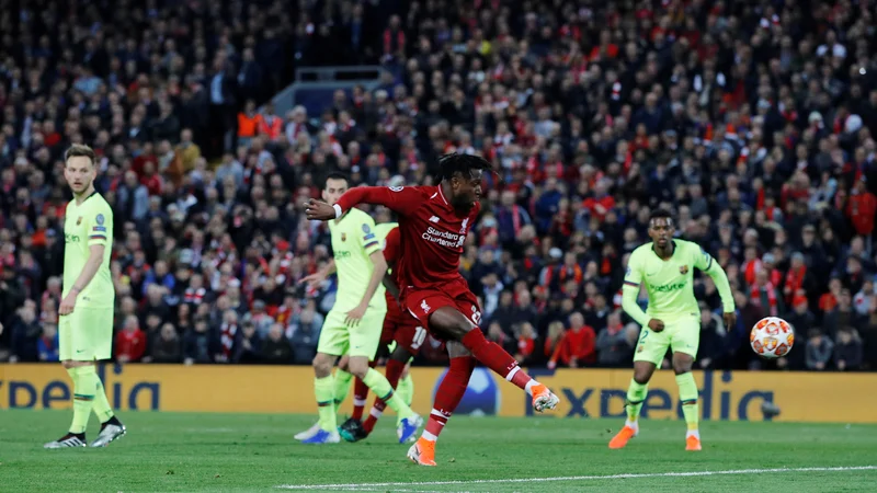 Fotografija: Divock Origi je začel in končal Liverpoolov veliki pok na Anfieldu. FOTO: Reuters