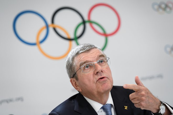 Predsednik Mednarodnega olimpijskega komiteja Thomas Bach zavrača očitke o prepozni odpovedi letošnjih OI. FOTO: AFP