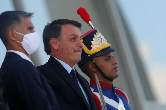 Predsednik Brazilije Jair Bolsonaro grozi, da bo Brazilija sledila zgeldu ZDA in izstopila iz WHO. FOTO: Adriano Machado/Reuters