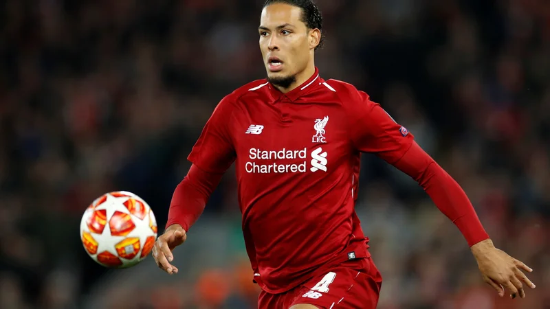 Fotografija: Pred enim letom so se lovorike v ligi prvakov veselili nogometaši Liverpoola, med katerimi je bil eden glavnih adutov Virgil van Dijk. FOTO: Reuters