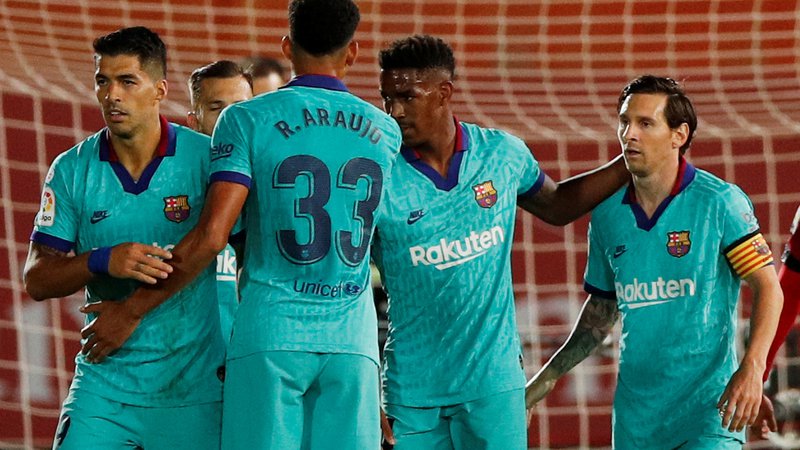 Fotografija: Barcelona je obrambo naslova začela z zanesljivo zmago na Mallorci, zadnji gol za 4:0 pa je dosegel Lionel Messi. FOTO: Reuters
