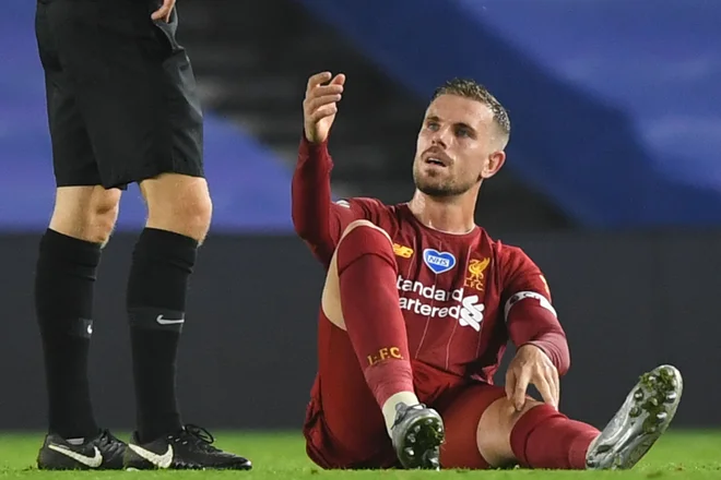 Jordan Henderson se je poškodoval na tekmi v Brightonu. FOTO:  Daniel Leal-olivas/AFP