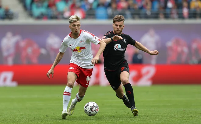 Kevin Kampl (levo) je v majici Leipziga osvojil nove tri točke v bundesligi. FOTO: AFP