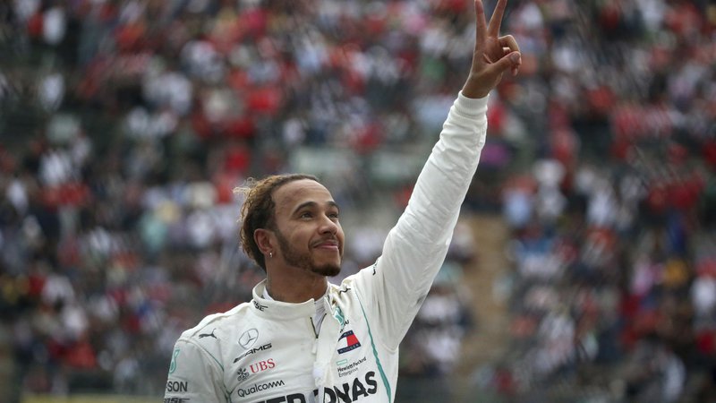 Fotografija: Lewis Hamilton je dve dirki pred koncem še petič postal svetovni prvak. FOTO: AP