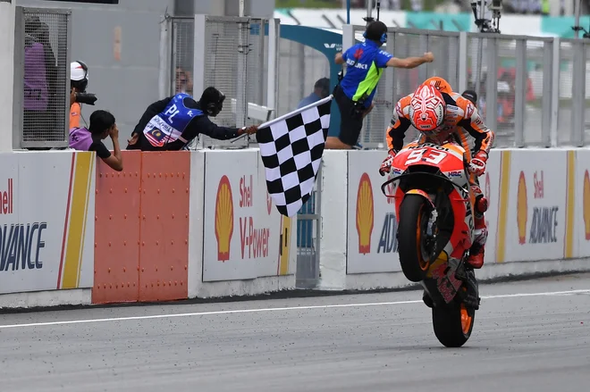 Španec Marc Marquez je ciljno črto prvi prečkal tudi v Sepangu. FOTO: AFP