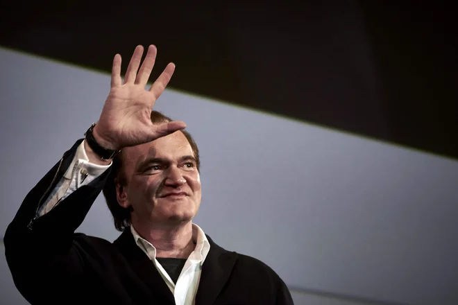 Kljub kričeči histeriji, ki spremlja vsak njegov korak po rdeči preprogi, Tarantino v Cannesu najde nirvano. FOTO: AFP