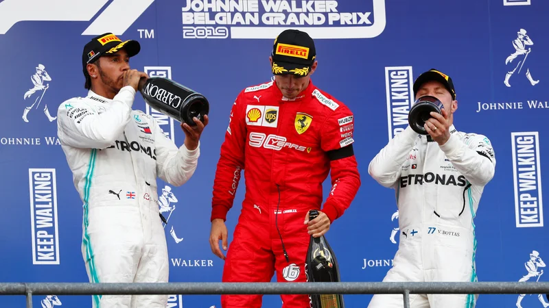 Fotografija: Formula One F1 - Belgian Grand Prix - Spa-Francorchamps, Stavelot, Belgium - September 1, 2019 Ferrari's Charles Leclerc celebrates on the podium after winning the race alongside second placed Mercedes' Lewis Hamilton and third placed Mercedes' Valtteri Bottas REUTERS/Francois Lenoir Foto Francois Lenoir Reuters