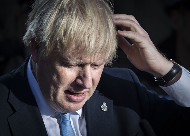 Britanski premier zahteva volitve v prvi polovici oktobra, prepričan, da bi v parlamentu dobil večino in tako nemoteno izpeljal odhod iz EU. FOTO: Danny Lawson/AFP