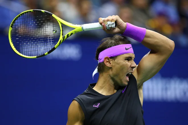 Rafael Nadal med dvobodjem z Matteom Berrettinijem. FOTO: Clive Brunskill/Afp