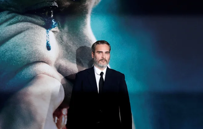 Joaquin Phoenix: ​Naredili smo film o fiktivnem liku v fiktivnem svetu, in upaš, da ga bodo ljudje videli takšnega, kot je. Ne moremo vendar kriviti filma za svet, ki je tako zjeban, da lahko karkoli sproži nasilje. FOTO: Mario Anzuoni Reuters