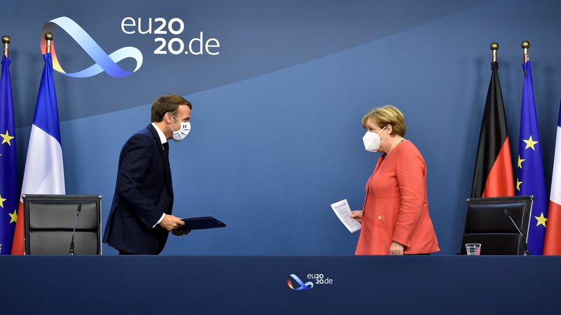 Fotografija: Angela Merkel in Emmanuel Macron FOTO: John Thys/Reuters