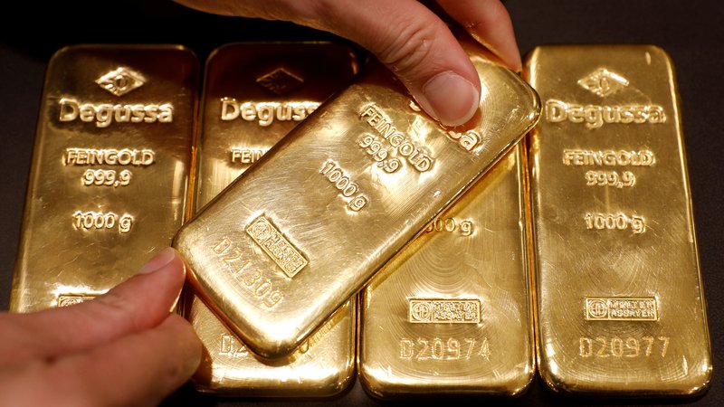 Fotografija: Žlatna kovina je v krizi najbolj zaželena naložba. FOTO: Edgar Su/ Reuters