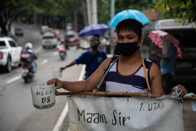 S Filipinov poročajo o več kot 5000 novih okužbah v enem dnevu. FOTO: Eloisa Lopez/Reuters