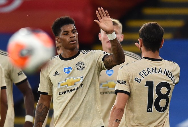 Unitedova asa Marcus Rashford in Bruno Fernandes naj bi se veselila končne zmage v evropski ligi. FOTO: Glyn KirK/Reuters