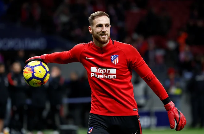 Jan Oblak ni bil okužen pri Atleticu. FOTO: Juan Medina/Reuters