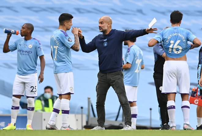 Manchester City je pod taktirko Pepa Guardiole že četrto sezono zapored izpadel pred finalom lige prvakov. FOTO: Shaun Botterill/Reuters