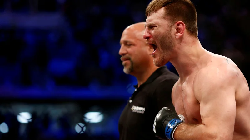 Fotografija: Stipe Miočić je ubranil šampionski pas združenja UFC v težki kategoriji. FOTO: Rodolfo Buhrer/Reuters