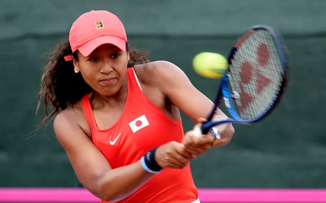 Japonka Naomi Osaka temnopoltega haitskega očeta je podprla bojkot, a bo tudi ona danes spet na igrišču. FOTO: Jose Jordan/AFP