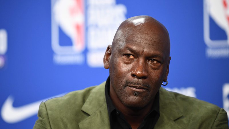 Fotografija: 75 odstotkov košarkarjev v ligi NBA je Afroameričanov, edini temnopolti lastnik kluba je Michael Jordan. FOTO: Franck Fife/AFP